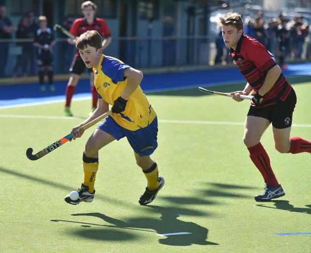 Southern Dogs’ Finn Ward attempts to cross with Canterbury Cavaliers’ Andrew Ross in pursuit...