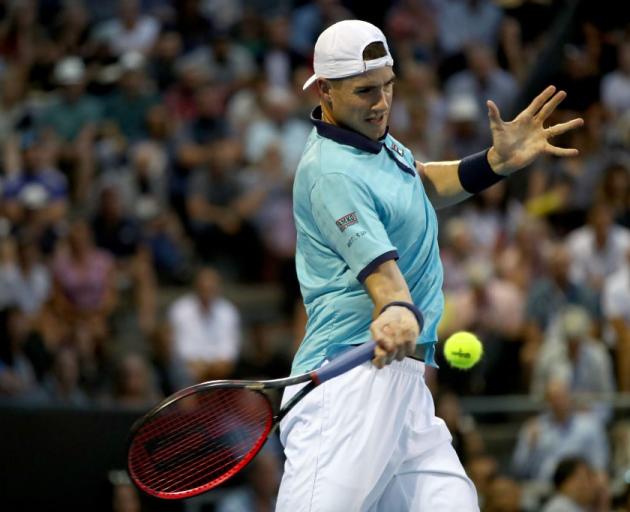 John Isner plays a forehand during his last appearance at the ASB Classic. Photo: Getty Images