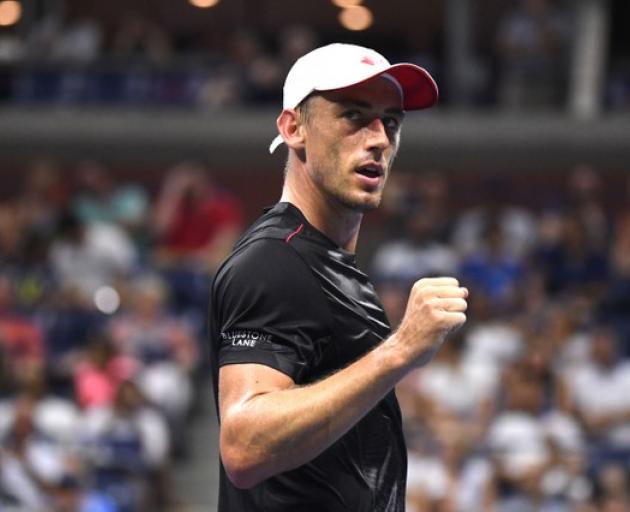 John Millman of Australia celebrates after defeating Roger Federer in the US Open. Photo: Reuters