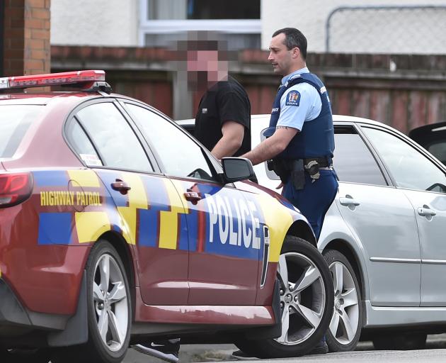 Police arrest a man  suspected of dealing drugs in the car park of the North Dunedin KFC...