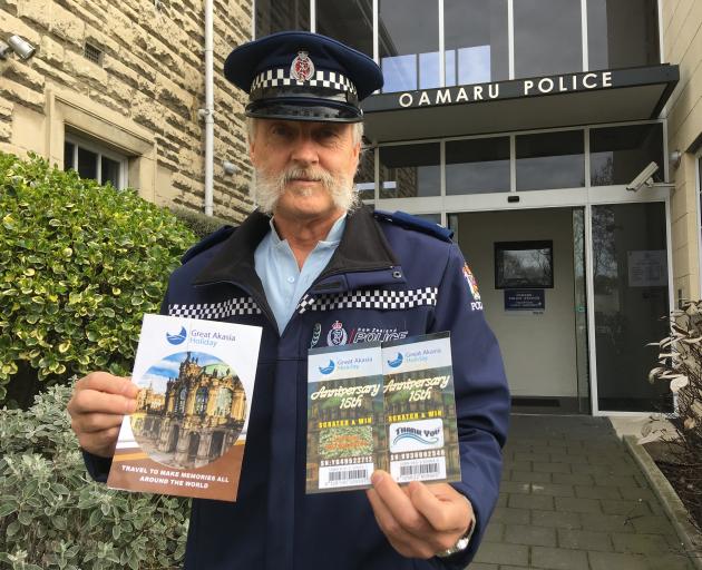 Senior Constable Bruce Dow, of Oamaru, with examples of correspondence that has been sent to Oamaru residents as part of a Malaysian-based mail scam. Photo: Daniel Birchfield