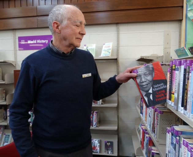 Oamaru Library manager Philip van Zijl with one of his favourite books, Nelson Mandela’s Long...