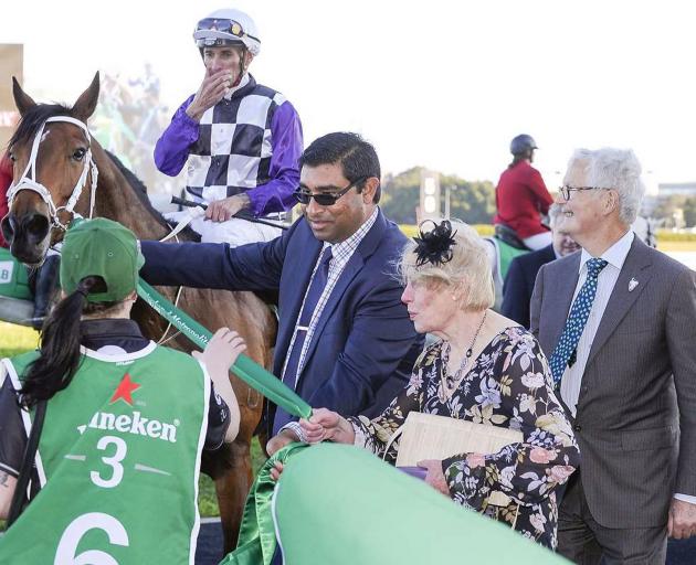 Patrick Erin is led back to the winner’s enclosure by Jan Smith, widow of his breeder, the late...