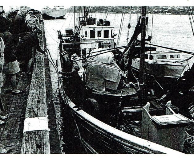 Malcolm MacLeod hands up a mooring line at the Rattrey St wharf. Photo: R.J. McDougall 