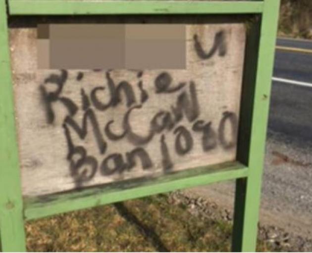 Defaced signs at Rangipo in the Central North Island abusing former All Black captain Richie...