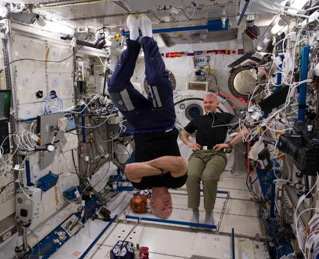 Astronauts in the International Space Station wear T-shirts made from merino wool by Armadillo Merino during an expedition in 2014. Central Otago farmers supply merino wool to New Zealand Merino, which sells it to companies such as Armadillo. Photo: NASA