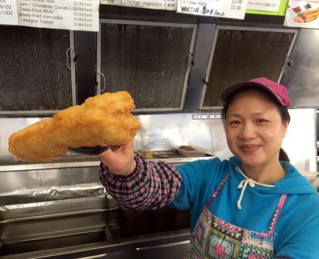 Gold Star Takeaways co-owner Minnie Yan presents a deep-fried cheese roll in her shop in Bradford today. Photo: Shawn McAvinue Gold Star Takeaways co-owner Minnie Yan presents a deep-fried cheese roll in her shop in Bradford today. Photo: Shawn McAvinue