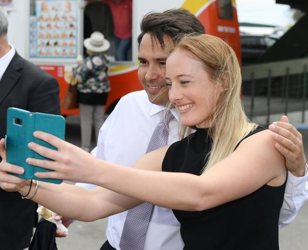 A smiling National Party leader Simon Bridges poses for a selfie  in Hastings on Thursday, after...