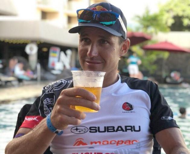 Wanaka Triathlete Braden Currie enjoys a well deserved beer after his fifth in the Ironman world...