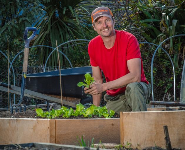 Ben Elms with raised beds in his garden enriched with compost. Photo: Si Williams