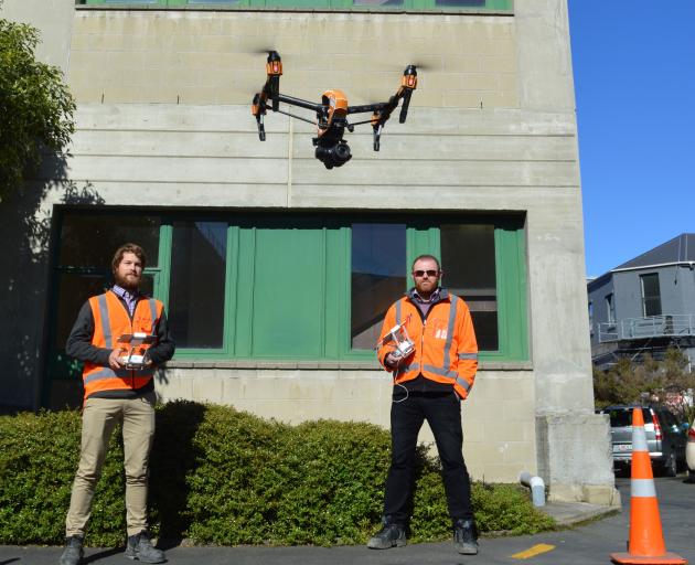 WSP Opus  drone  pilot Scott Kvick (left) and senior structural engineer Dave Ellis use a drone...