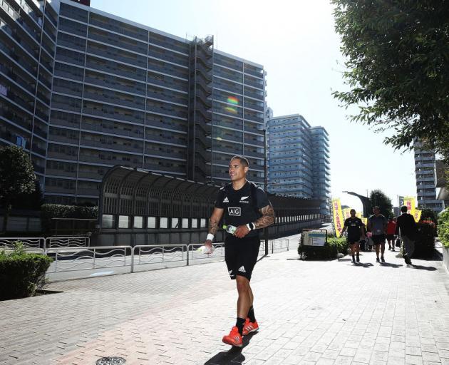 All Black halfback Aaron Smith walks back to the team bus after an All Black gym session in Tokyo on Monday. Photo: Getty Images