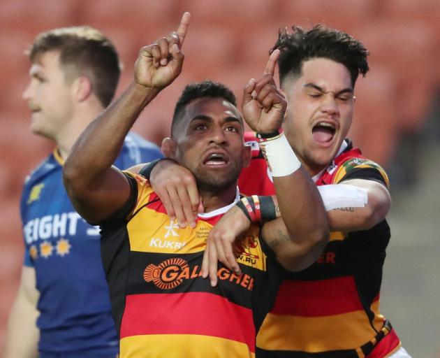 Waikato's Sevu Reece (centre) celebrates his try with team-mate Quinn Tupaea. Photo: Getty Images 