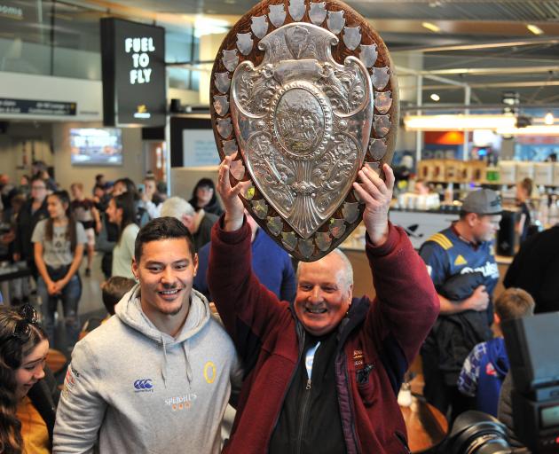 Otago second five-eighth Sio Tomkinson and his dad, David, with the Ranfurly Shield at Dunedin...
