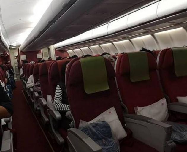 The row of four empty seats on a Hong Kong Airlines flight that a passenger had to pay $100 to...
