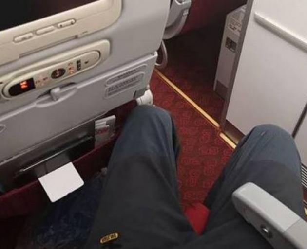 Richard Mountain's legs were too long for the aisle seat he was given on a Hong Kong Airlines...