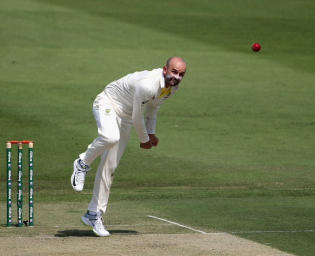 Nathan Lyon bowls for Australia in the second test against Pakistan. Photo: Getty Images