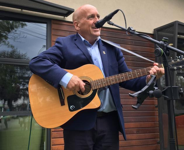 Central Otago Mayor Tim Cadogan sings the opening number at the inaugural Alexandra Buskers...