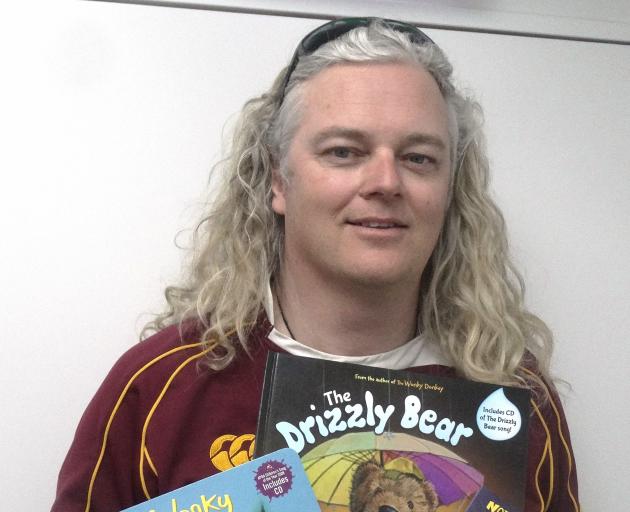 Kiwi author Craig Smith with his popular children's book, The Wonky Donkey, and his new book, The...