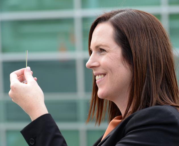 Research and Education Advanced Network NZ chief executive Nicole Ferguson holds part of a fibre...