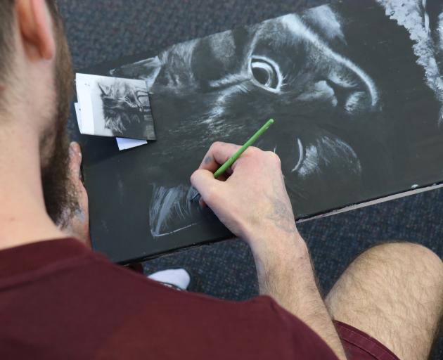 Offenders at Otago Corrections Facility are creating artworks to be sold in the Dunedin Art Show in November, with all the funds going to White Ribbon New Zealand. Photo: Jack Conroy