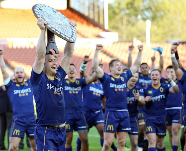 Michael Collins holds the Ranfurly Shield aloft, a highlight in Otago's season. Photo: Getty Images
