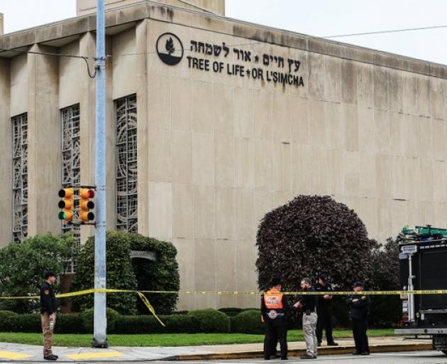 Police officers guard the Tree of Life synagogue following shooting at the synagogue in Pittsburgh. Photo: Reuters