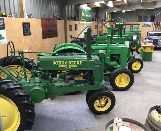 Once he sold them, now he collects them - some of the John Deere tractors in Gordon Handy's collection. Photo: Chris Tobin