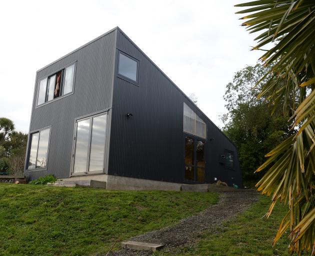 This black-clad Portobello home faces the sun and the water. 