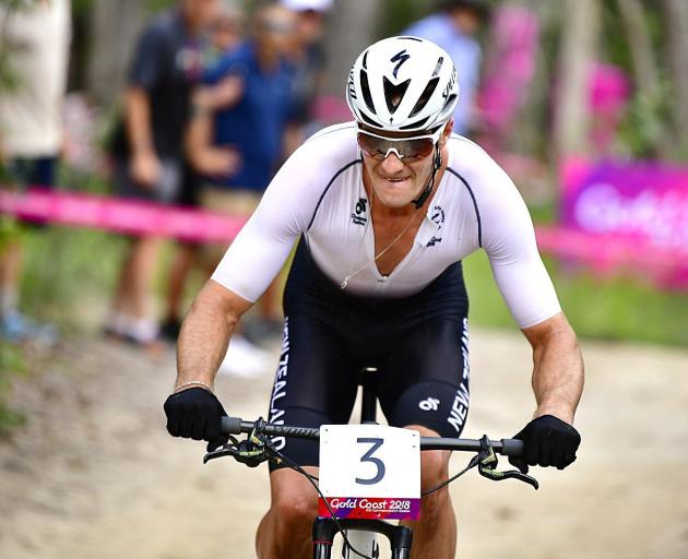 New Zealand mountain biker Sam Gaze on the way to winning gold at the Gold Coast Commonwealth...