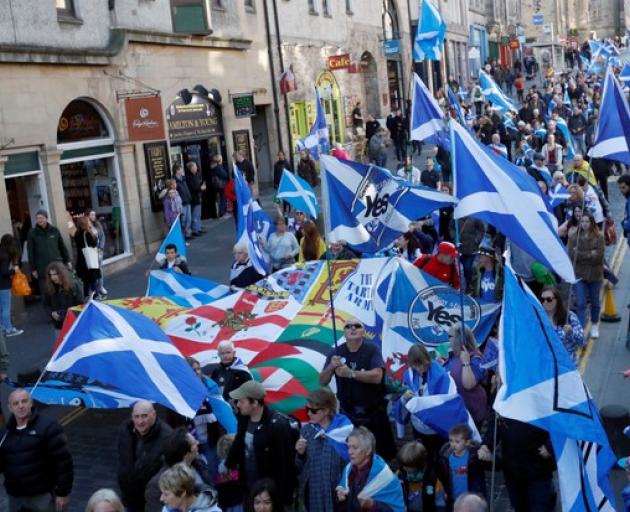 The campaigners waved giant blue Scotland flags and sported kilts as they congregated in a park near the Scottish Parliament building. Photo: Reuters