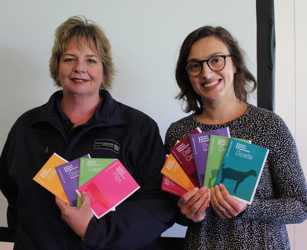 MPI manager of animal welfare sector support Leonie Ward (left) and animal welfare senior adviser Shari Mannan hold pamphlets which have been created for quick and easy information about new animal welfare regulations. Photo: Ella Stokes