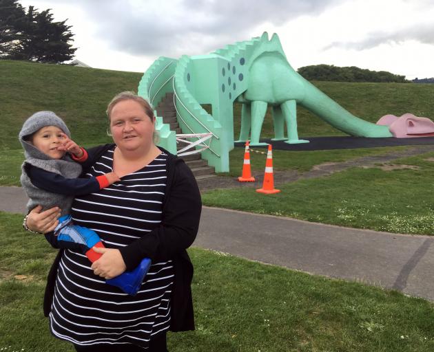 Janine McCarron and her son Ryder (2), of Pukekohe, are disappointed the dinosaur slide in Marlow Park was closed yesterday. Photo: Shawn McAvinue
