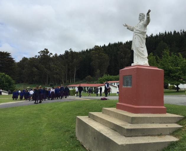 Pupils walk towards the chapel at St Kevin’s on Monday afternoon. Photo: Gregor Richardson