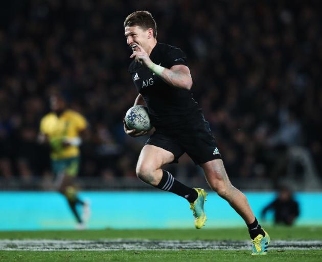 Beauden Barrett on the way to scoring one of his four tries against the Wallabies. Photo: Getty...