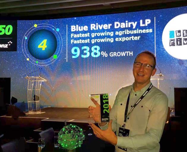 Blue River Dairy general manager Robert Boekhout accepts the Deloitte Fast 50 award for being New...