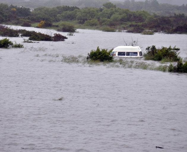 A whitebaiter's abandoned van was flooded on an island in the middle of the Hokitika River...
