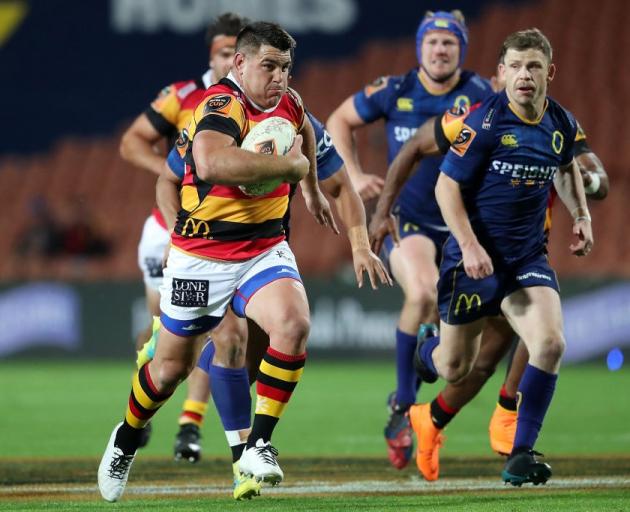 Waikato's Dwayne Sweeney makes a break as Otago's Kurt Hammer (right) chases after him during the...