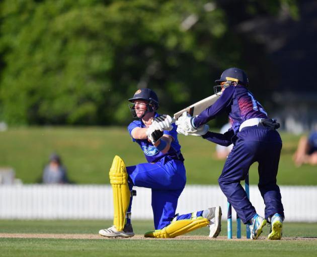 Otago Volts all-rounder Nathan Smith plays a sweep shot during his innings of 43 in the Shell Trophy match against Auckland at Lincoln yesterday, won by the Volts. The Auckland wicketkeeper is Ben Horne. Photo: Getty Images