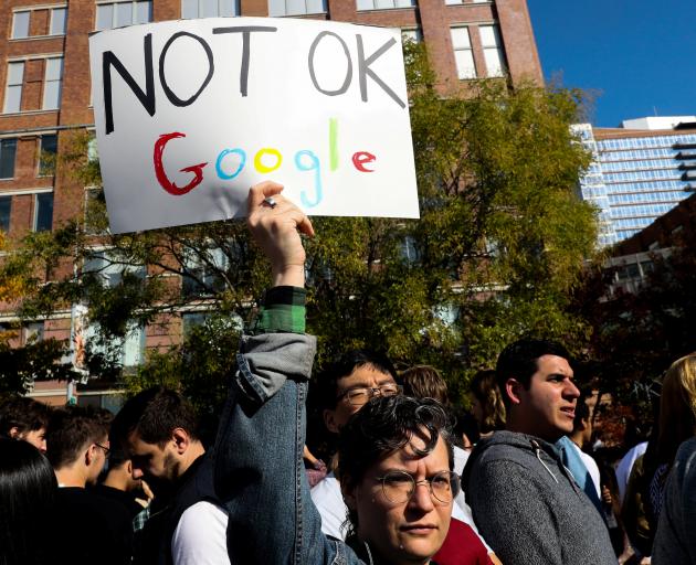 A worker holds a sign outside Google offices in New York. Photo: Reuters