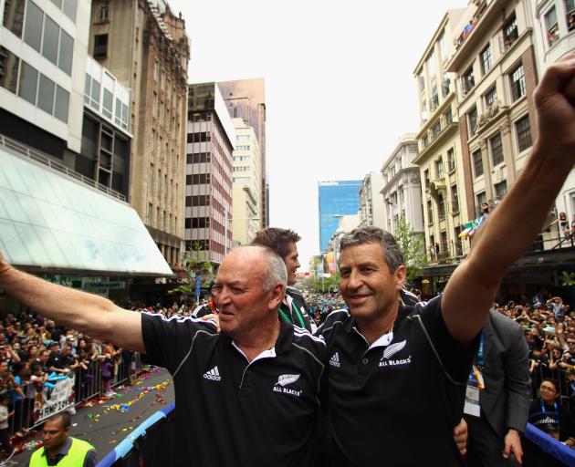 Graham Henry (left) and Wayne Smith celebrate at the parade in Auckland after coaching the All...