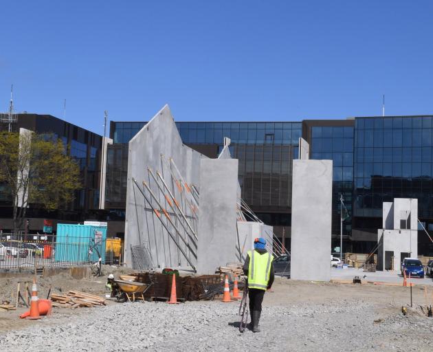 A pre-cast concrete panel goes up in front of Christchurch's justice precinct, one of 16 jobs which tipped Fletcher into reporting massive losses. Photo: Stephen Jaquiery