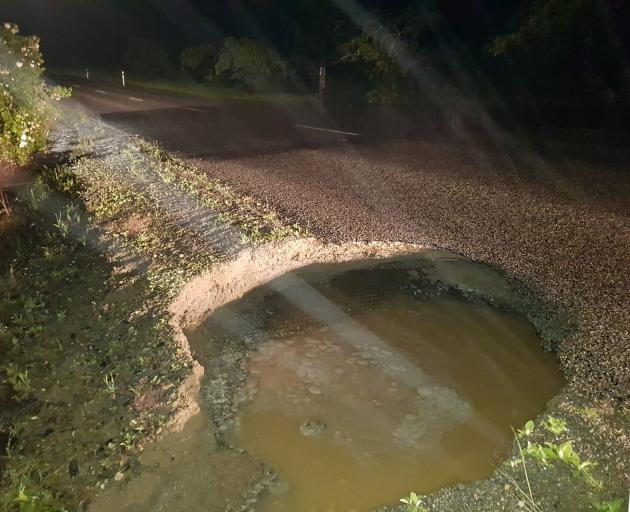 A culvert appears to have collapsed in Westview Dr, Weston, causing flooding and creating a hole...