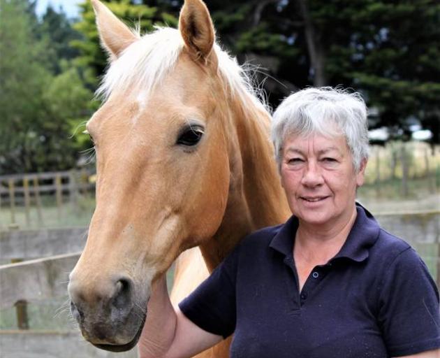 Ros Rowe with Peaches, a horse she described as a golden horse with a golden personality. Photo: Supplied via NZ Herald