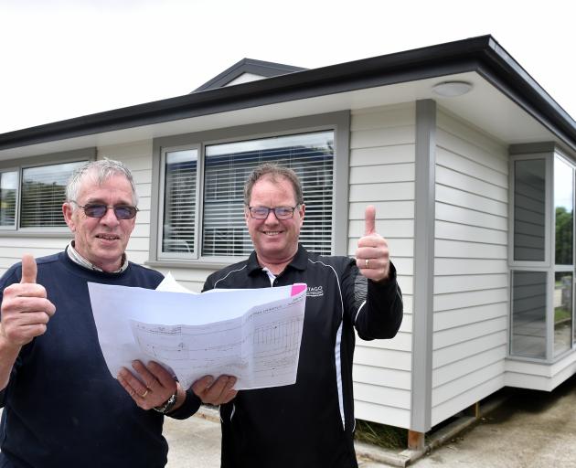 Otago Polytechnic carpentry programme manager Graham Burgess (left) and Kevin Dunbar with senior lecturer Kevin Dunbar in front of their 2018 auction house. Photo: Peter McIntosh
