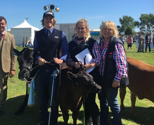 Jane Jenkins (right) was pleased to win runner-up to the supreme champion beef cattle with her Angus cow with calf at foot, led by her adult children Tim and Ruby Hauschild.