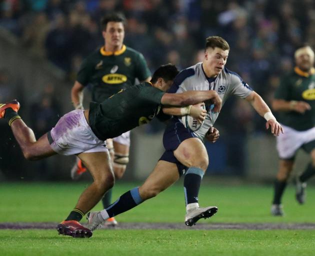 Scotland's Huw Jones in action with South Africa's Damian de Allende. Photo: Reuters