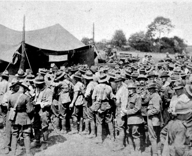 New Zealand troops queueing to place bets at the totalisator run on the gymkhana sports at a New Zealand base in France. - Otago Witness, 27.11.1918.