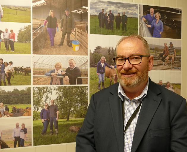 Mataura Valley Milk chief executive Bernard May with photos of farmers/shareholders in the background. Photo: Ken Muir