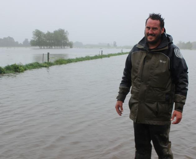 Taieri dairy farmer Mike Holmes stands on a freshly sown paddock of fodder beet, which now resembles a lake. Photo: Ella Stokes